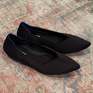 Rothy's Elegant Black Flats with Blue Accent